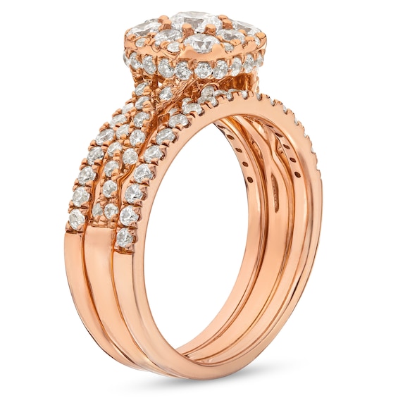 1-1/2 CT. T.w. Cushion Multi-Diamond Twist Shank Three Piece Bridal Set in 10K Rose Gold