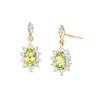 Thumbnail Image 1 of Oval Peridot and 1/4 CT. T.W. Diamond Sunburst Frame Dangle Drop Earrings in 10K Gold