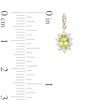 Thumbnail Image 3 of Oval Peridot and 1/4 CT. T.W. Diamond Sunburst Frame Dangle Drop Earrings in 10K Gold