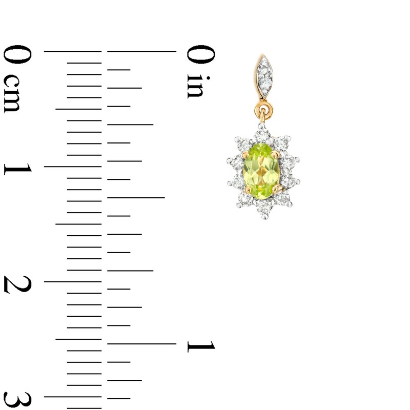 Main Image 3 of Oval Peridot and 1/4 CT. T.W. Diamond Sunburst Frame Dangle Drop Earrings in 10K Gold