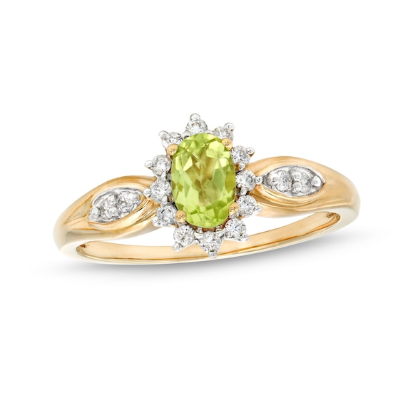Oval Peridot and 1/6 CT. T.w. Diamond Sunburst Frame Ring in 10K Gold