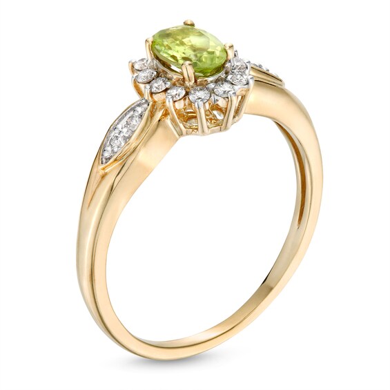 Oval Peridot and 1/6 CT. T.w. Diamond Sunburst Frame Ring in 10K Gold