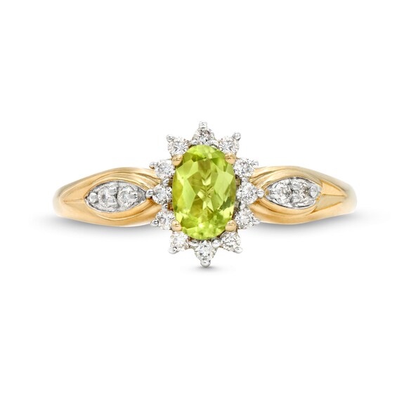 Oval Peridot and 1/6 CT. T.w. Diamond Sunburst Frame Ring in 10K Gold