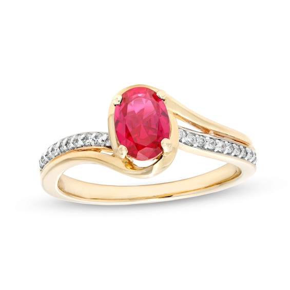 Oval Lab-Created Ruby and 1/10 CT. T.w. Diamond Bypass Ring in 10K Gold