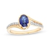 Thumbnail Image 1 of Oval Blue Lab-Created Sapphire and 1/10 CT. T.W. Diamond Bypass Ring in 10K Gold