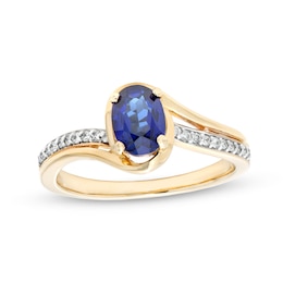 Oval Blue Lab-Created Sapphire and 1/10 CT. T.W. Diamond Bypass Ring in 10K Gold