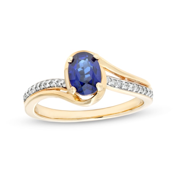 Oval Blue Lab-Created Sapphire and 1/10 CT. T.w. Diamond Bypass Ring in 10K Gold
