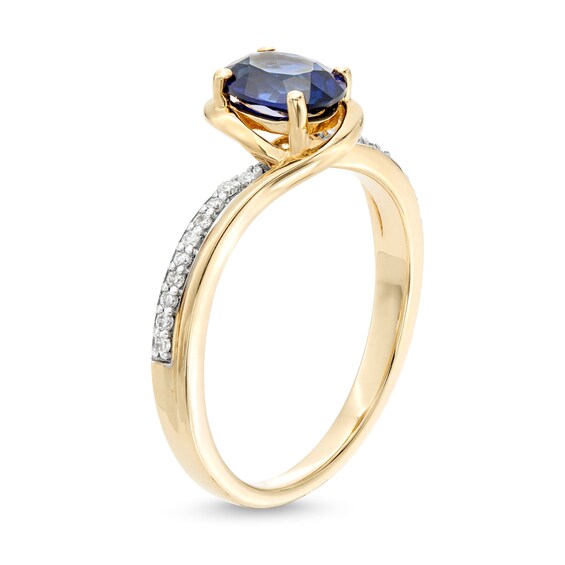 Oval Blue Lab-Created Sapphire and 1/10 CT. T.w. Diamond Bypass Ring in 10K Gold