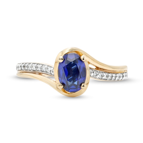 Oval Blue Lab-Created Sapphire and 1/10 CT. T.w. Diamond Bypass Ring in 10K Gold