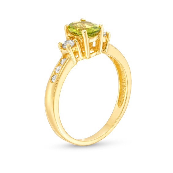 Oval Peridot and 1/4 CT. T.w. Diamond Three Stone Ring in 14K Gold
