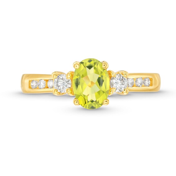 Oval Peridot and 1/4 CT. T.w. Diamond Three Stone Ring in 14K Gold