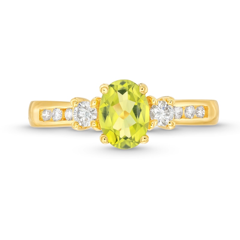 Oval Peridot and 1/4 CT. T.W. Diamond Three Stone Ring in 14K Gold