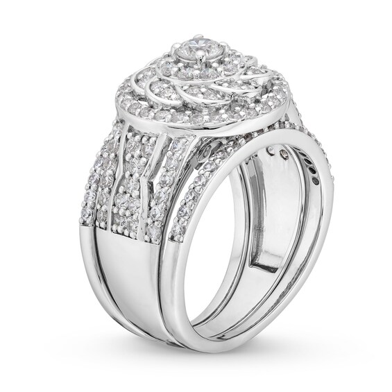 1-1/2 CT. T.w. Diamond Frame Celtic-Style Flower Bridal Set in 10K White Gold