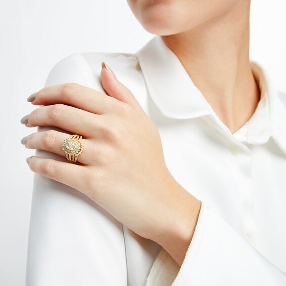 1-1/4 CT. T.w. Oval Multi-Diamond Sunburst Frame Split Shank Bridal Set in 10K Gold