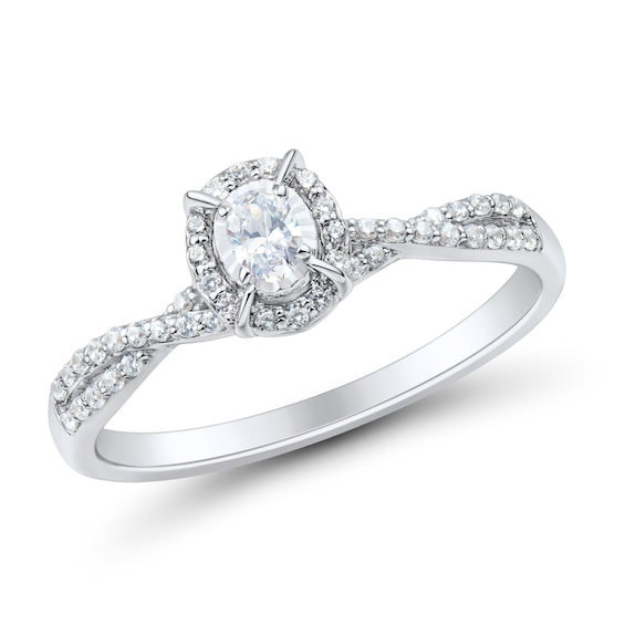 1/4 CT. T.w. Oval Diamond Frame Criss-Cross Engagement Ring in 10K White Gold