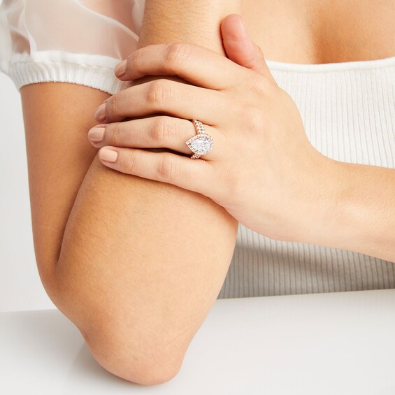 4-1/2 CT. T.w. Pear-Shaped Certified Lab-Grown Diamond Frame Bridal Set in 14K Rose Gold (I/Si2)