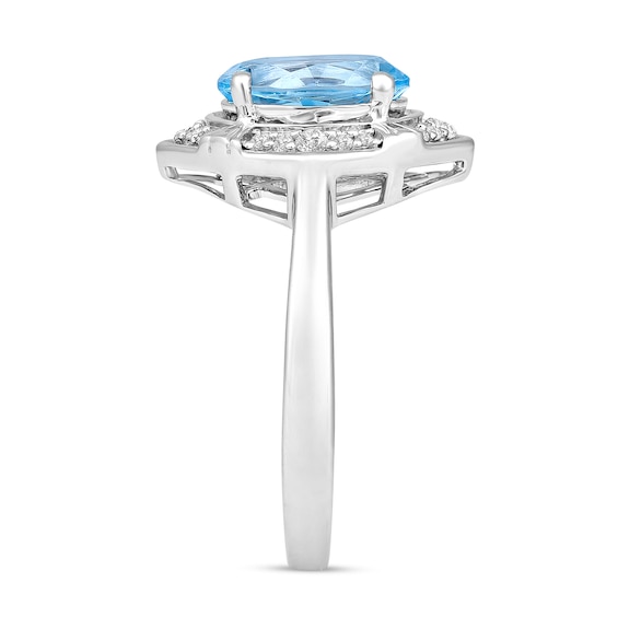 Oval Sky Blue Topaz and 1/8 CT. T.w. Diamond Tilted Frame Ring in 10K White Gold