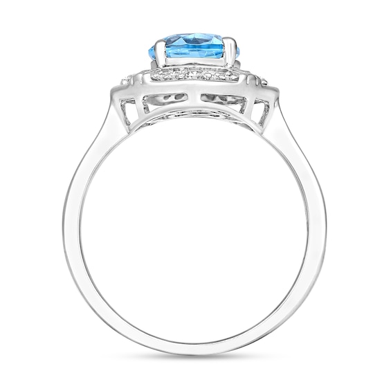 Oval Sky Blue Topaz and 1/8 CT. T.w. Diamond Tilted Frame Ring in 10K White Gold