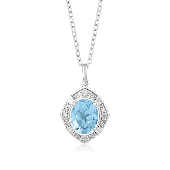 Oval Sky Blue Topaz and 1/8 CT. T.w. Diamond Tilted Frame Pendant in 10K White Gold