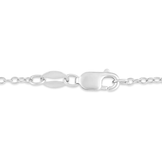Oval Sky Blue Topaz and 1/8 CT. T.w. Diamond Tilted Frame Pendant in 10K White Gold