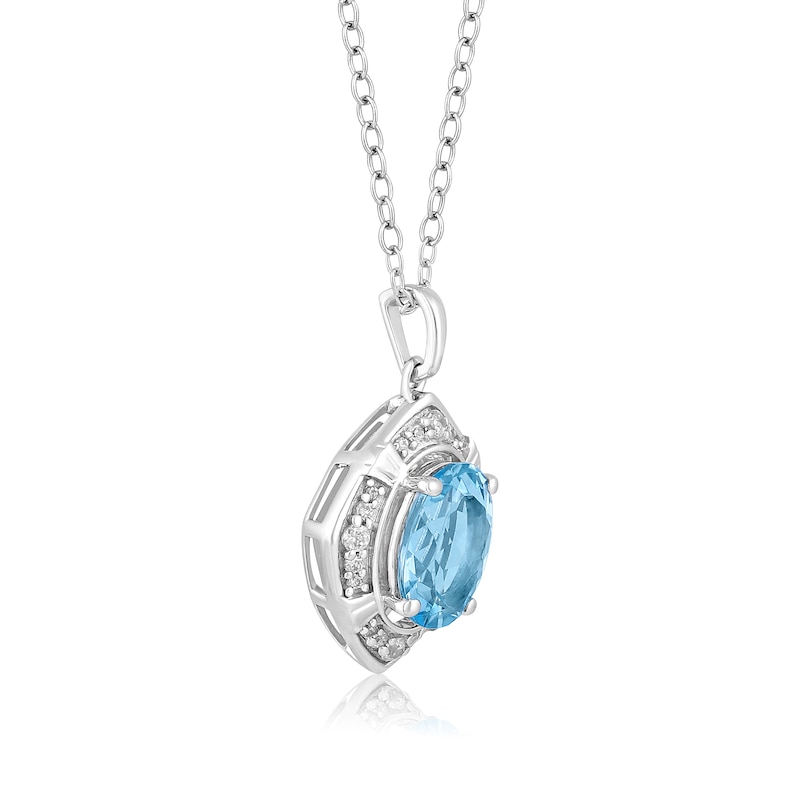 Main Image 5 of Oval Sky Blue Topaz and 1/8 CT. T.W. Diamond Tilted Frame Pendant in 10K White Gold