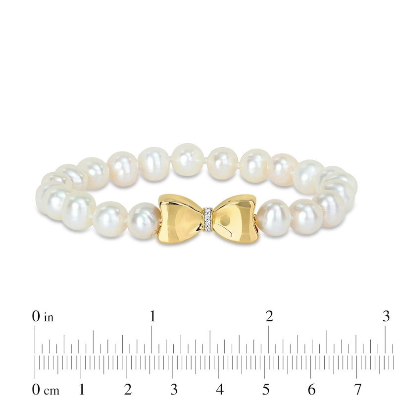 Main Image 2 of Eternally Bonded 7.0-7.5mm Freshwater Cultured Pearl Strand and 1/20 CT. T.W. Diamond Bow Stretch Bracelet with 10K Gold