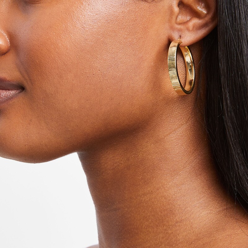 Main Image 2 of Diamond-Cut 6.0mm Oval Hoop Earrings in Hollow 14K Gold