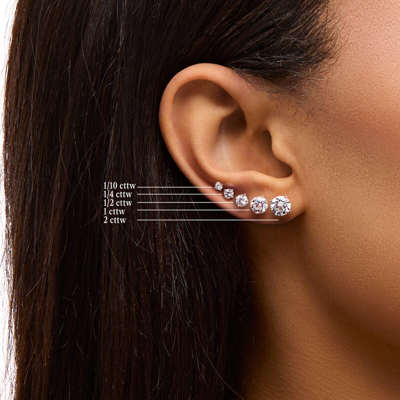 Main Image 4 of 1/2 CT. T.W. Diamond Solitaire Stud Earrings in 10K White Gold (J/I3)