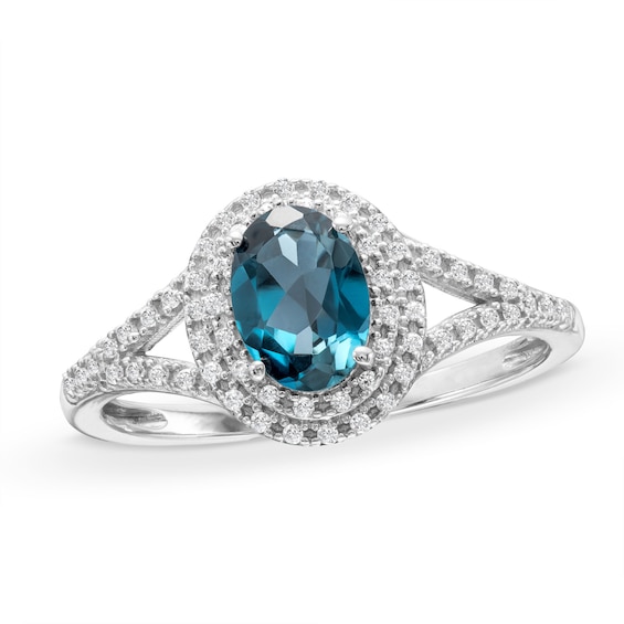 Oval London Blue Topaz and 1/6 CT. T.w. Diamond Framed Ring in 10K White Gold