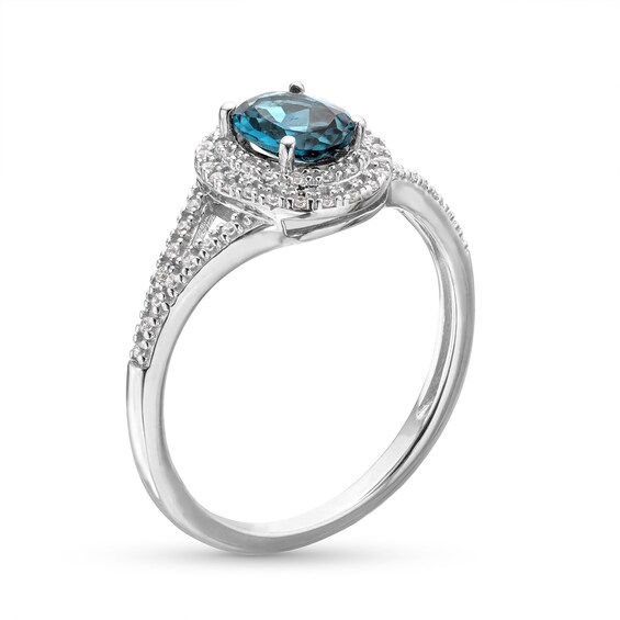 Oval London Blue Topaz and 1/6 CT. T.w. Diamond Framed Ring in 10K White Gold