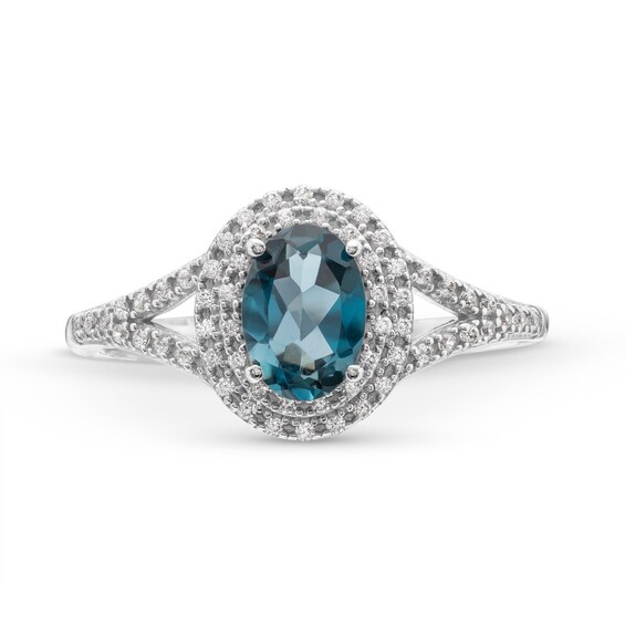 Oval London Blue Topaz and 1/6 CT. T.w. Diamond Framed Ring in 10K White Gold