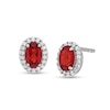 Thumbnail Image 1 of Oval Garnet and White Lab-Created Sapphire Frame Stud Earrings in Sterling Silver