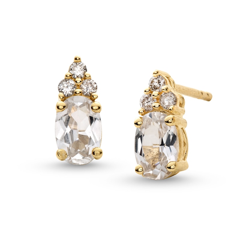 Main Image 1 of Oval White Lab-Created Sapphire and 1/10 CT. T.W. Diamond Stud Earrings in 10K Gold
