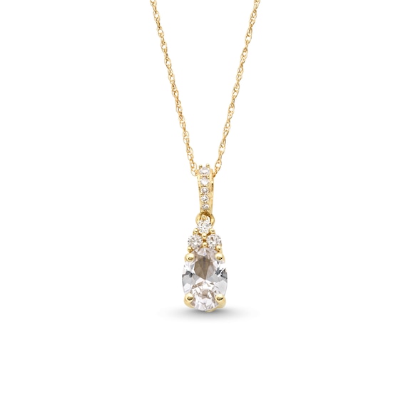 Oval White Lab-Created Sapphire and 1/15 CT. T.w. Diamond Pendant in 10K Gold