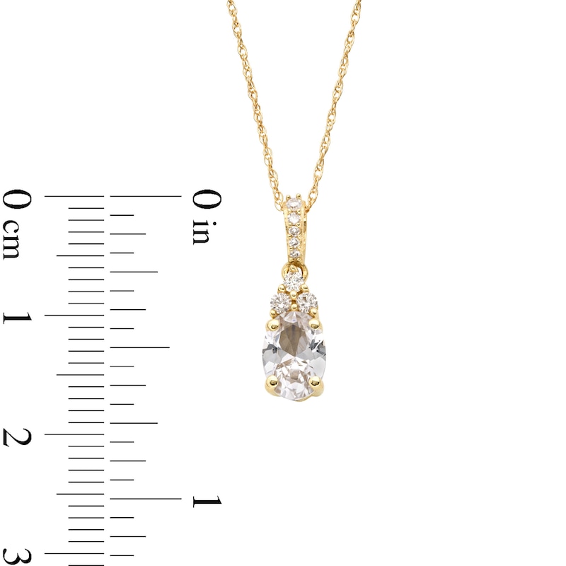 Oval White Lab-Created Sapphire and 1/15 CT. T.W. Diamond Pendant in 10K Gold