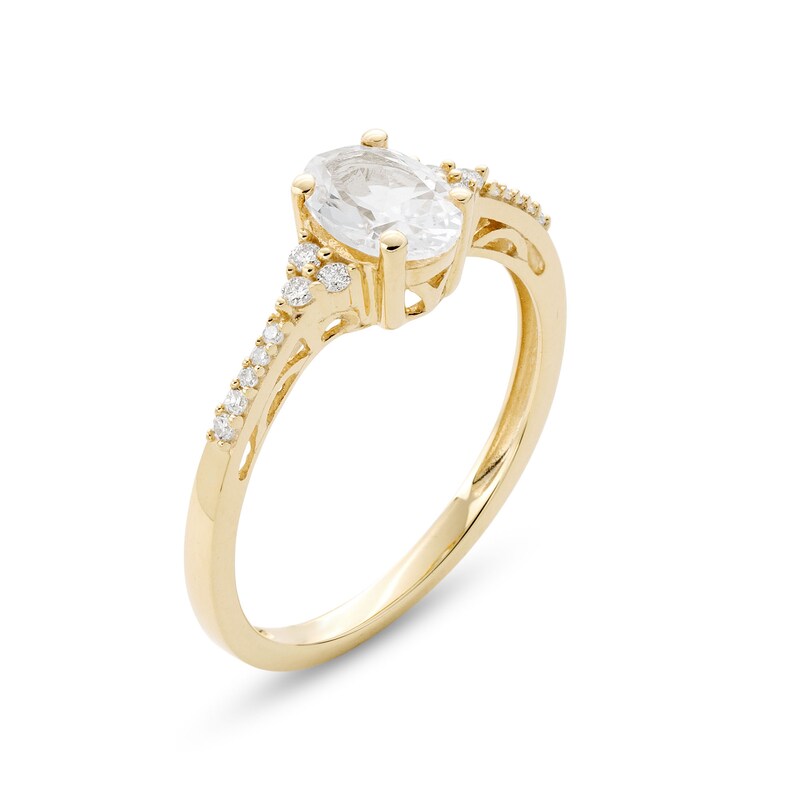 Main Image 3 of Oval White Lab-Created Sapphire and 1/10 CT. T.W. Diamond Ring in 10K Gold