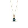 Thumbnail Image 1 of Pear-Shaped London Blue Topaz and 1/8 CT. T.W. Diamond Frame Twist Pendant in 10K Gold