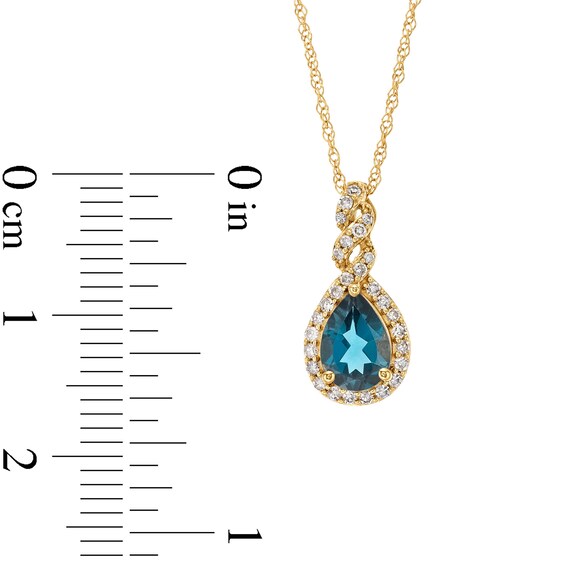 Pear-Shaped London Blue Topaz and 1/8 CT. T.w. Diamond Frame Twist Pendant in 10K Gold