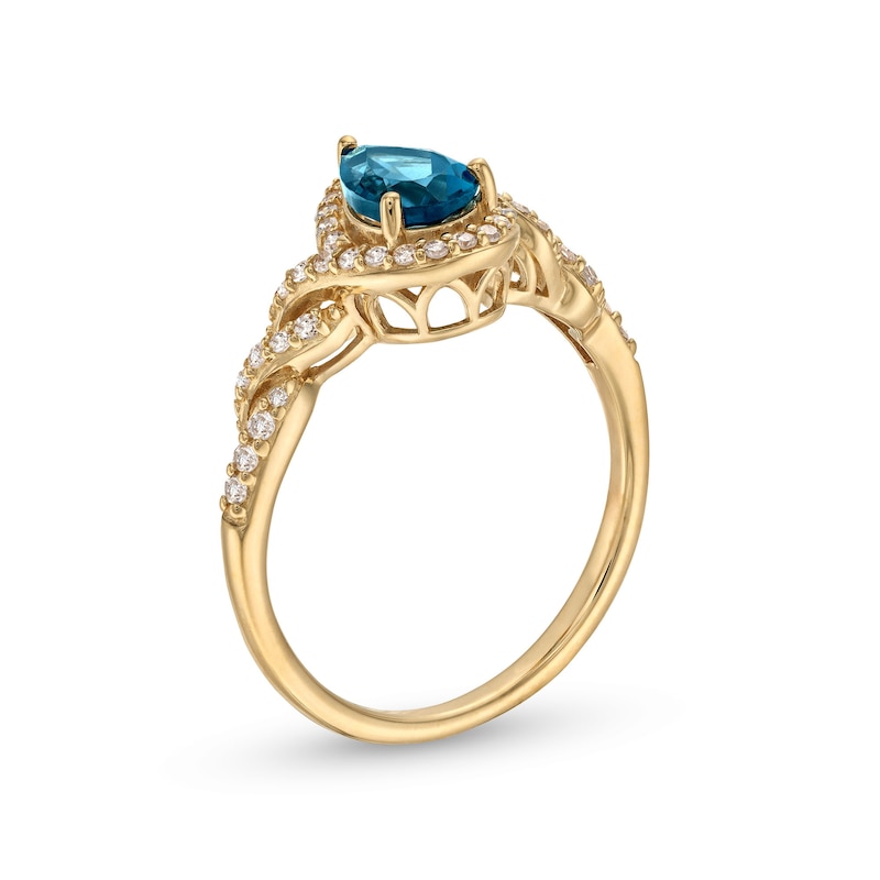 Pear-Shaped London Blue Topaz and 1/5 CT. T.W. Diamond Frame Twist Shank Ring in 10K Gold