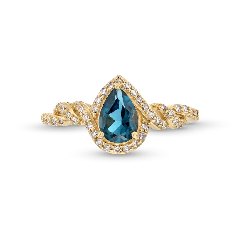 Pear-Shaped London Blue Topaz and 1/5 CT. T.W. Diamond Frame Twist Shank Ring in 10K Gold