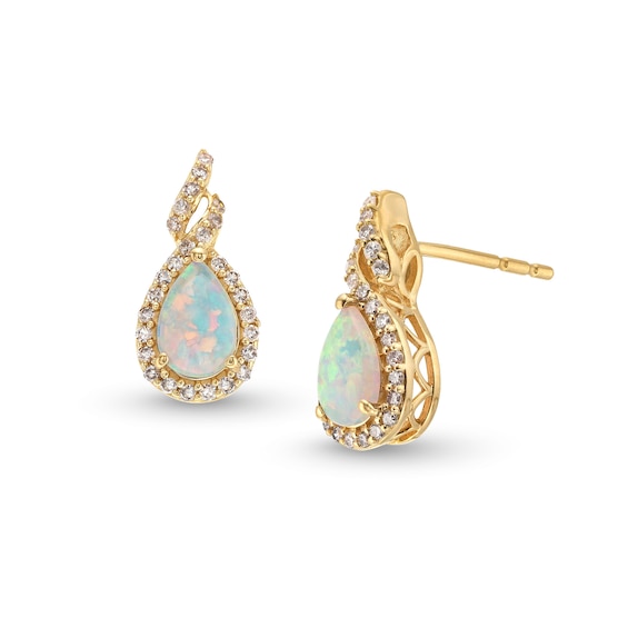 Pear-Shaped Lab-Created Opal and 1/6 CT. T.w. Diamond Frame Twist Stud Earrings in 10K Gold