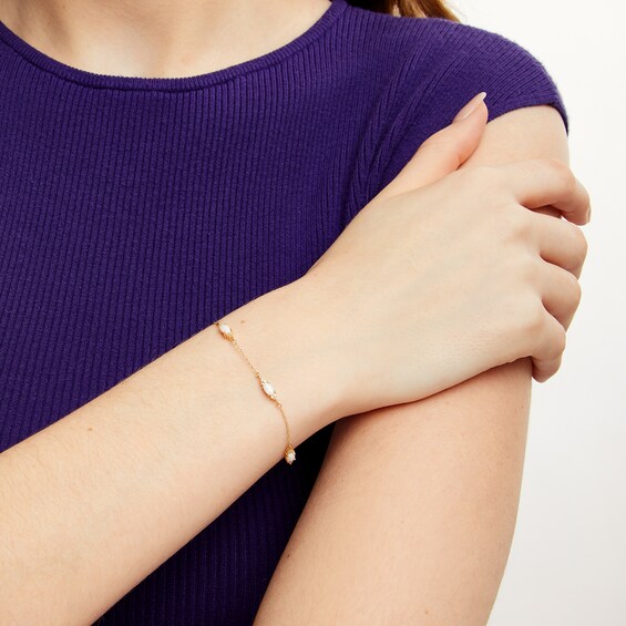 Oval Lab-Created Opal and 1/15 CT. T.w. Diamond Three Stone Station Bracelet in 10K Gold - 7.25"