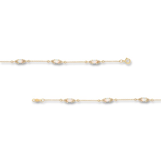 Oval Lab-Created Opal and 1/15 CT. T.w. Diamond Three Stone Station Bracelet in 10K Gold - 7.25"