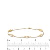 Thumbnail Image 4 of Oval Lab-Created Opal and 1/15 CT. T.W. Diamond Three Stone Station Bracelet in 10K Gold - 7.25"