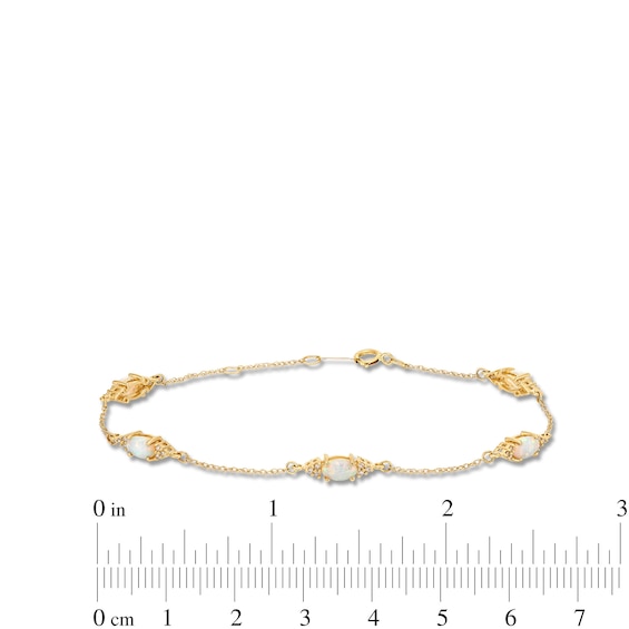 Oval Lab-Created Opal and 1/15 CT. T.w. Diamond Three Stone Station Bracelet in 10K Gold - 7.25"