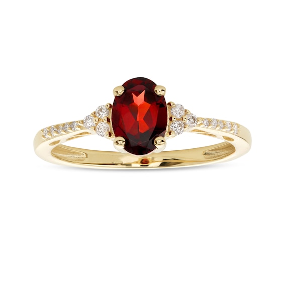 Oval Garnet and 1/10 CT. T.w. Diamond Ring in 10K Gold