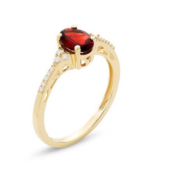 Oval Garnet and 1/10 CT. T.w. Diamond Ring in 10K Gold