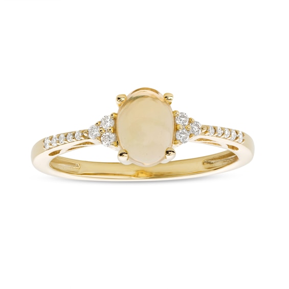 Oval Opal and 1/10 CT. T.w. Diamond Ring in 10K Gold