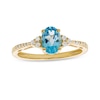 Thumbnail Image 1 of Oval Swiss Blue Topaz and 1/10 CT. T.W. Diamond Ring in 10K Gold