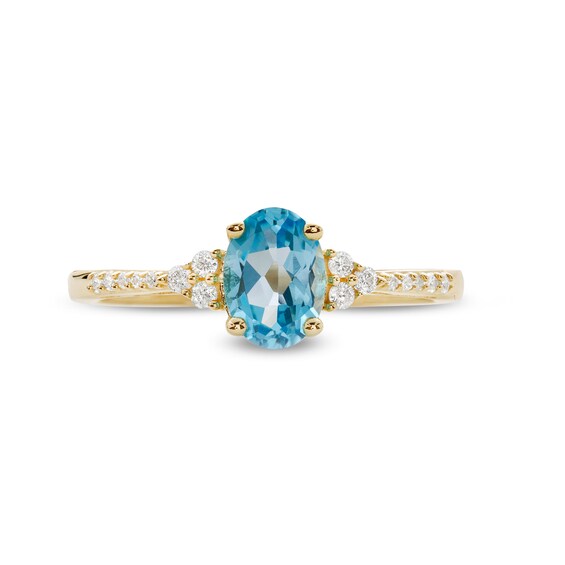 Oval Swiss Blue Topaz and 1/10 CT. T.w. Diamond Ring in 10K Gold